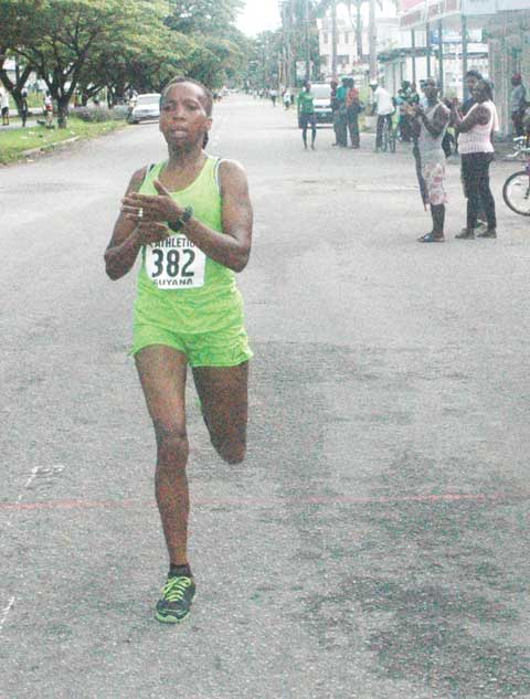 Euleen crosses the finish line during the 2013 Athletics Association of Guyana Annual Independence Half Marathon 