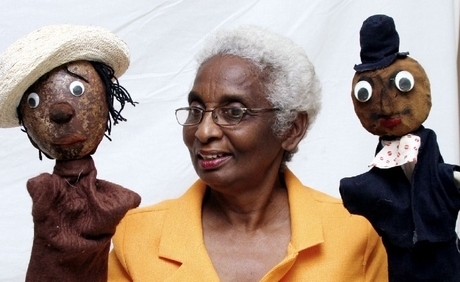 Jean Small manipulates two puppets during a Portmore puppet show at the Lions' Civic Centre during Portmore Week activities in 2008. - photo by Anthony 